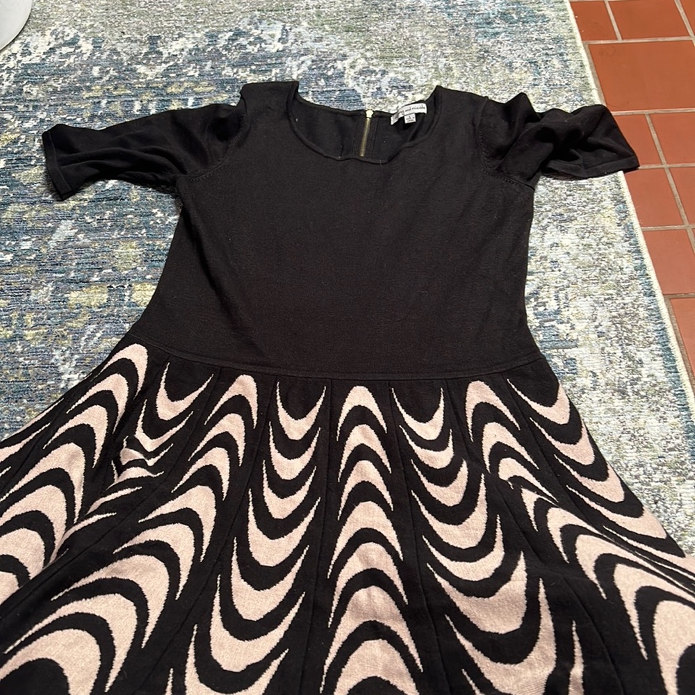 Black dress with a white pattern bottom.